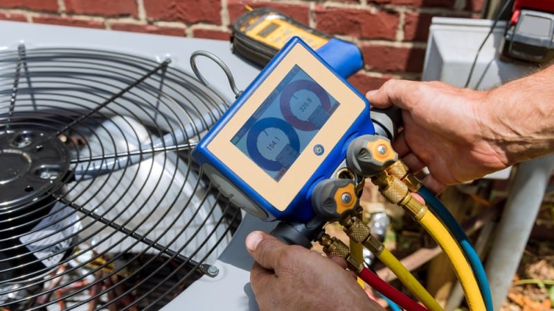 AC repair tech fixing HVAC in Dallas ac repair tech fixing hvac in dallas